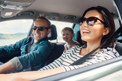 family laughing in car