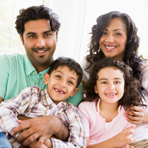 Mom and dad with small kids with missing teeth