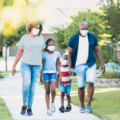 family on a walk with mask