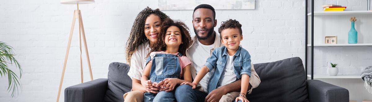 Smiling family of four
