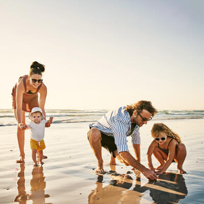 A family playing on the beach