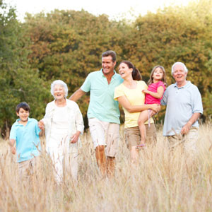 Multi-generational family walking outdoors