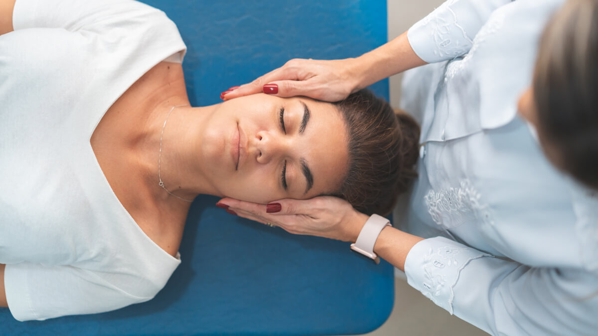 Hands on woman's head