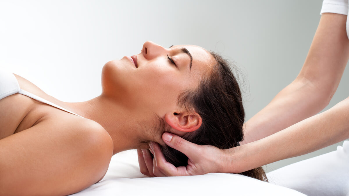 woman's neck being adjusted