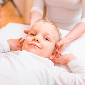Female chiropractor with little boy