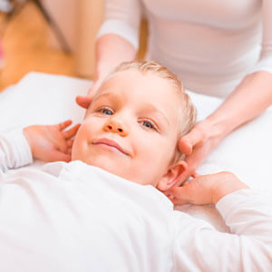 little boy being adjusted