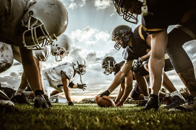 Men on field playing football