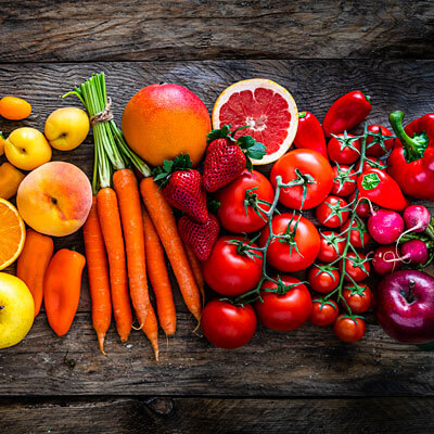 red and orange veggeis and fruits