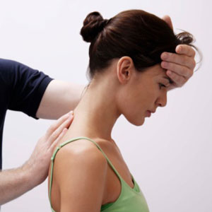 Woman receiving chiropractic adjustment. 