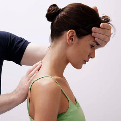 A patient receiving a chiropractic adjustment to the neck