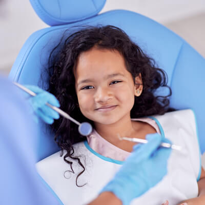 Cute girl in dental chair