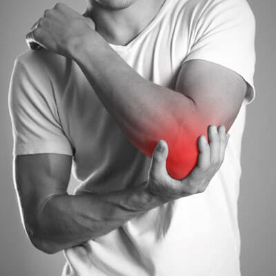 man with pain in elbow