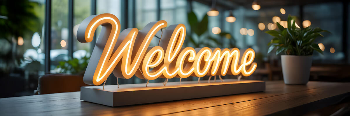 Welcome sign on desk