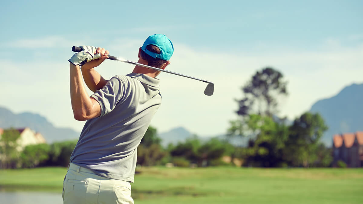 Golfer in bright blue hat