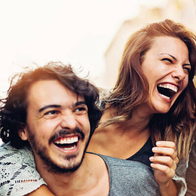 man and woman laughing