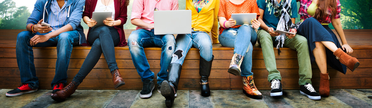 Group of teens sitting on a bench