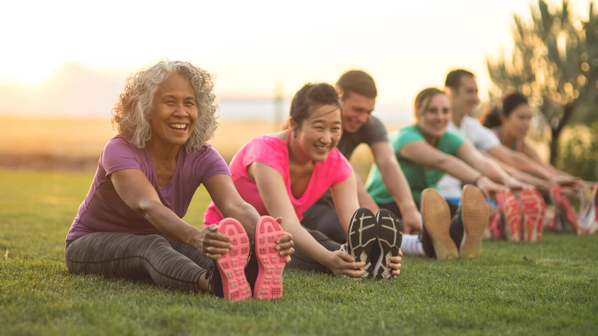 group stretch in park