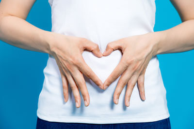 Heart hands on stomach