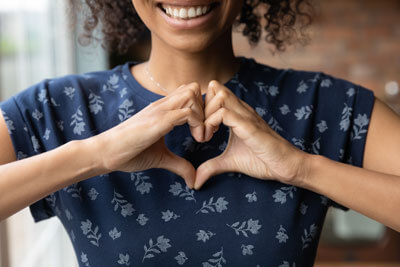 Woman making heart with hands