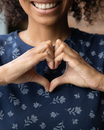 Woman making heart with hands