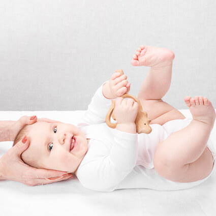 Happy Baby Legs Curled Up During Neck Adjustments