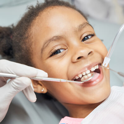 smiling kid during dental appointment 