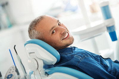 happy man in dental chair