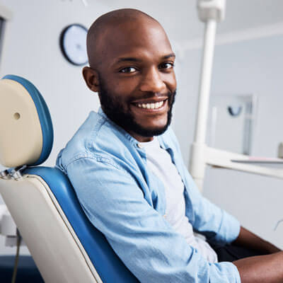 happy man in dental chair