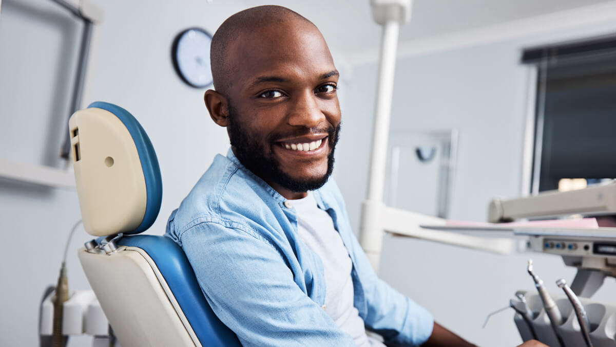 happy man in dental chair