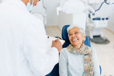 Woman looking up at dentist