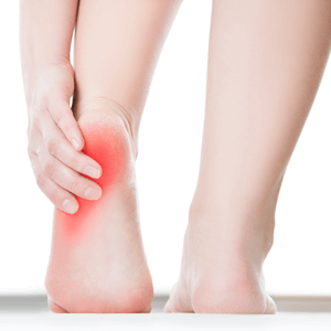 Woman holding heel in pain