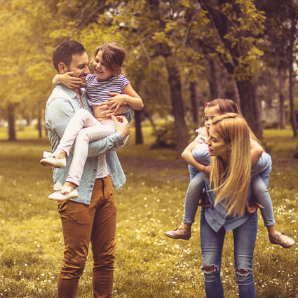 Family of four out in nature