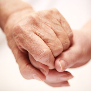 Older people holding hands