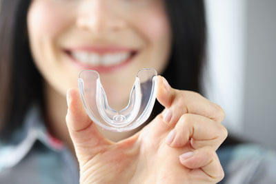 Holding up clear mouthguard