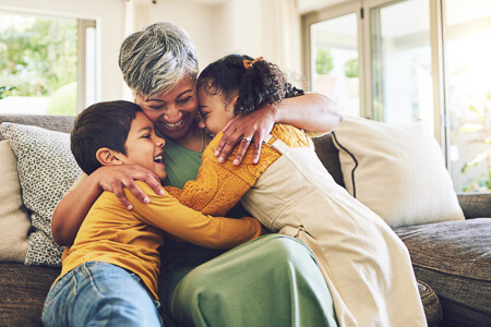 Grandma hugging her grandkids