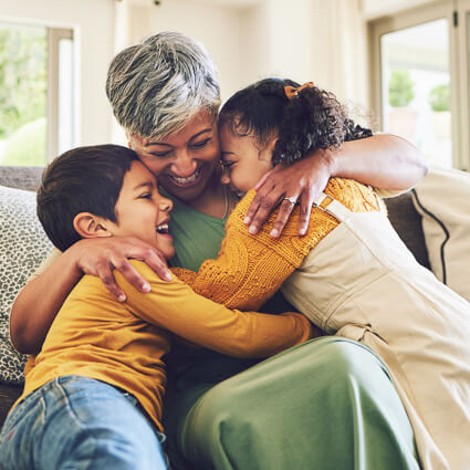 Grandma hugging grandchildren