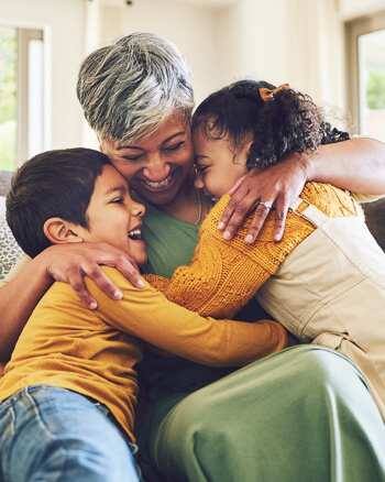 Grandma embracing her grandchildren