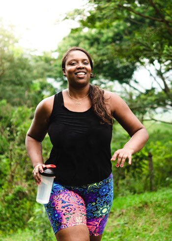 Woman jogging in woods