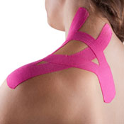 Woman with pink rock tape applied to shoulder