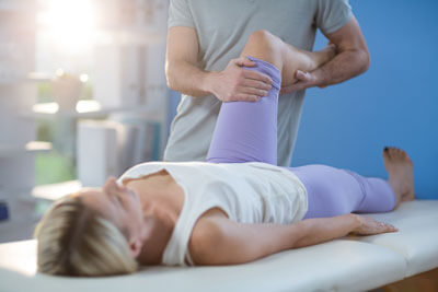 Woman exercising knee