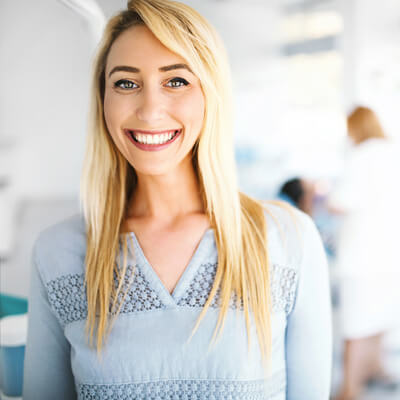 lady in bright dental office