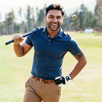 man laughing and golfing