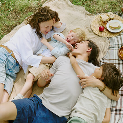 Family of four having a picnic