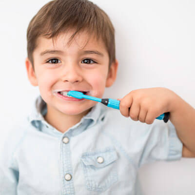 boy brushing his teeth