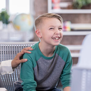 Boy sitting in chair