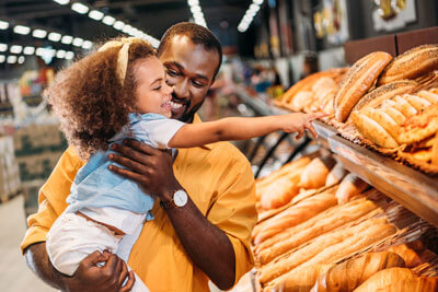 little girl choosing bread