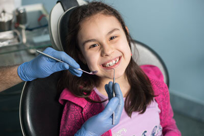 girl having teeth cleaned