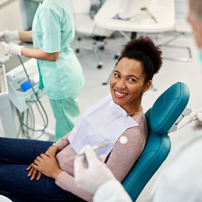 person in dental chair during appointment