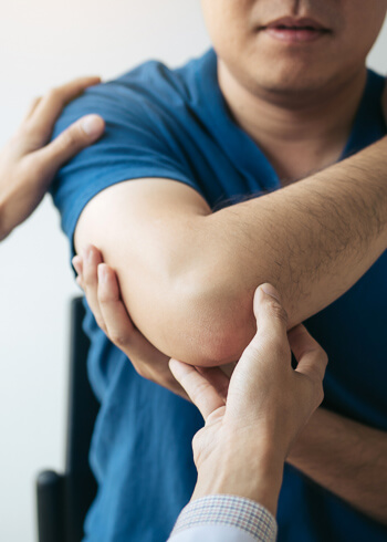 Chiropractor treating patient's shoulder