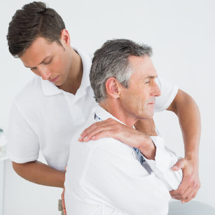 Man crossing arm while having back adjusted